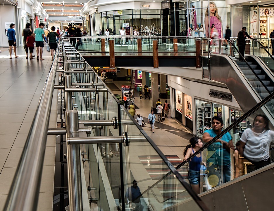 People going up the escalator in mall 