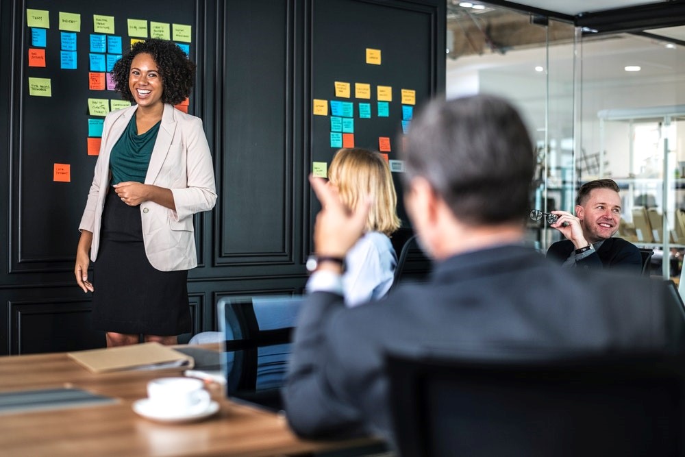 women giving a presentation at her workplace